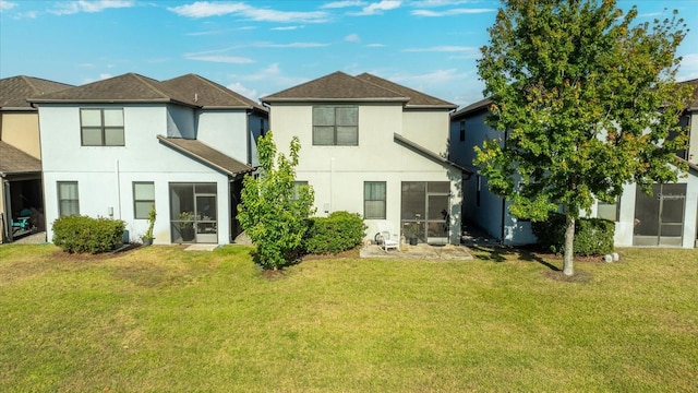 1227 Ballard Green Pl, Brandon, FL 33511 - back of property with a yard, a sunroom, and stucco siding