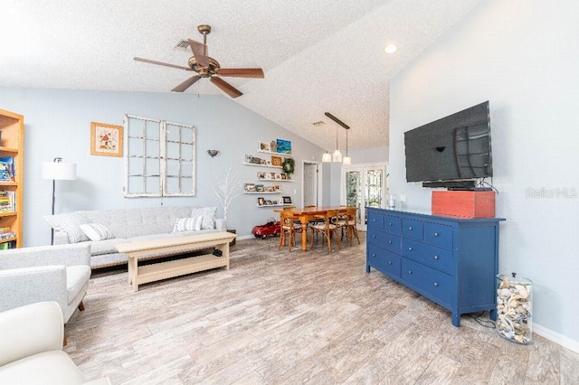 2435 Comerwood Dr, Spring Hill, FL 34609 - living room featuring light wood-style flooring, a textured ceiling, vaulted ceiling, recessed lighting, and ceiling fan