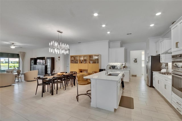 17583 Holly Well Ave, Wimauma, FL 33598 - kitchen with light countertops, open floor plan, decorative backsplash, and a sink