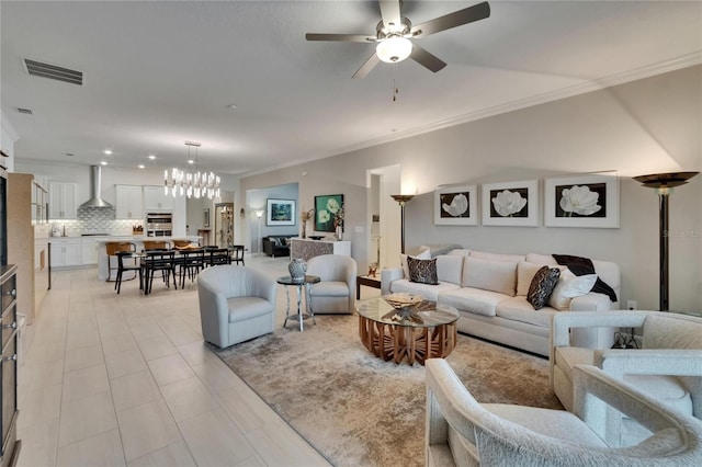 17583 Holly Well Ave, Wimauma, FL 33598 - living area featuring ornamental molding, light tile patterned flooring, visible vents, and ceiling fan with notable chandelier