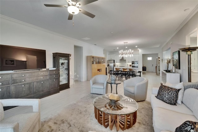 17583 Holly Well Ave, Wimauma, FL 33598 - living room featuring light wood-style floors, crown molding, and ceiling fan with notable chandelier