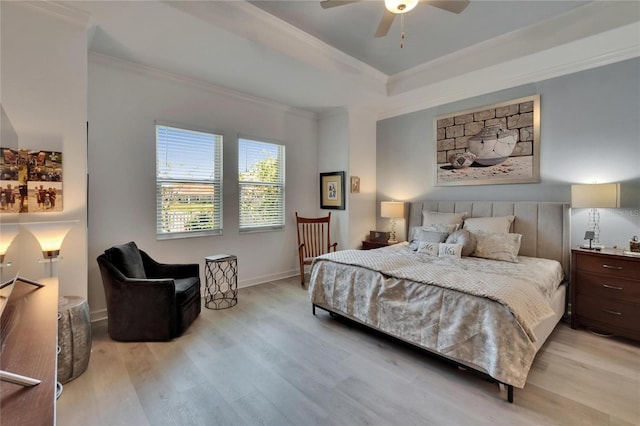 17583 Holly Well Ave, Wimauma, FL 33598 - bedroom with light wood finished floors, a raised ceiling, ornamental molding, baseboards, and ceiling fan