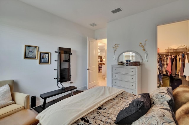 17583 Holly Well Ave, Wimauma, FL 33598 - bedroom featuring a spacious closet and visible vents