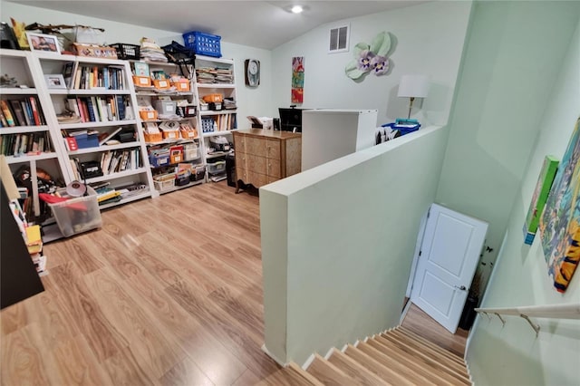 17583 Holly Well Ave, Wimauma, FL 33598 - office space featuring lofted ceiling, wood finished floors, and visible vents