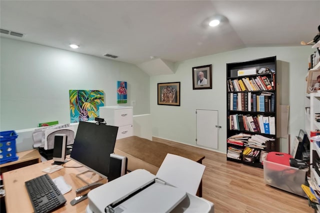 17583 Holly Well Ave, Wimauma, FL 33598 - home office with vaulted ceiling, wood finished floors, and visible vents
