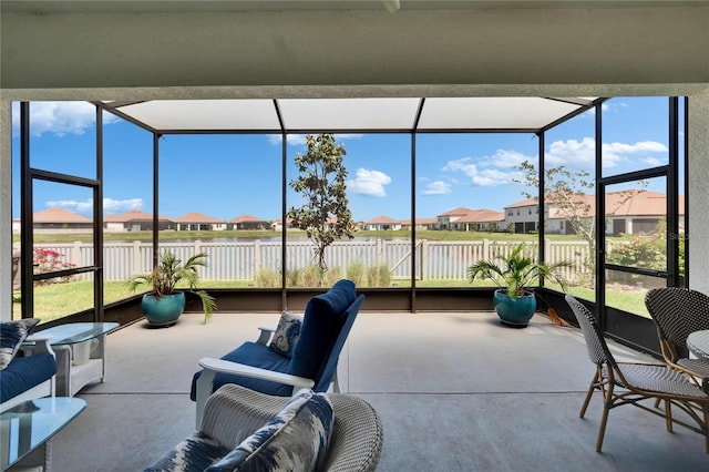 17583 Holly Well Ave, Wimauma, FL 33598 - sunroom with a wealth of natural light, a residential view, and a water view