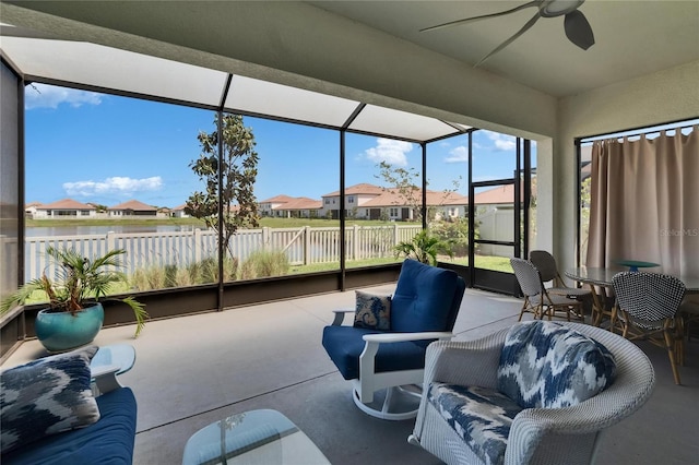 17583 Holly Well Ave, Wimauma, FL 33598 - sunroom featuring a ceiling fan and a residential view