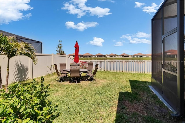 17583 Holly Well Ave, Wimauma, FL 33598 - view of yard featuring a fenced backyard, a residential view, and a water view