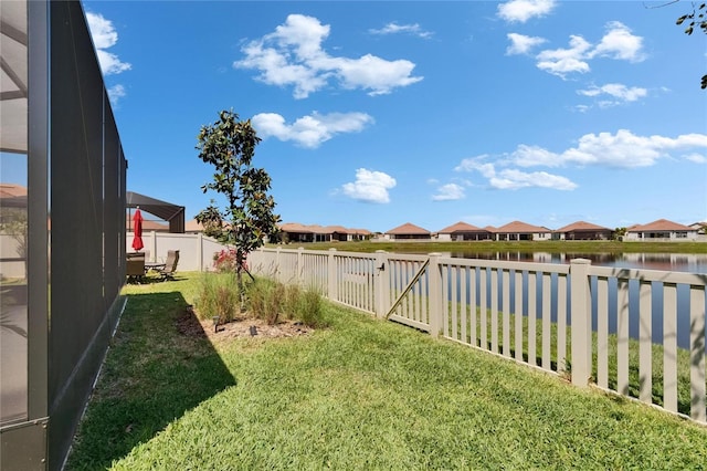 17583 Holly Well Ave, Wimauma, FL 33598 - view of yard featuring a fenced backyard, a residential view, and a water view