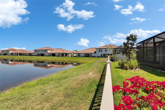 17583 Holly Well Ave, Wimauma, FL 33598 - view of yard with glass enclosure, a residential view, and a water view