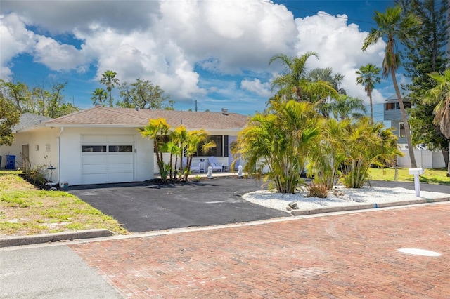 225 Cevera Dr, Dunedin, FL 34698 - single story home featuring an attached garage, roof with shingles, and driveway