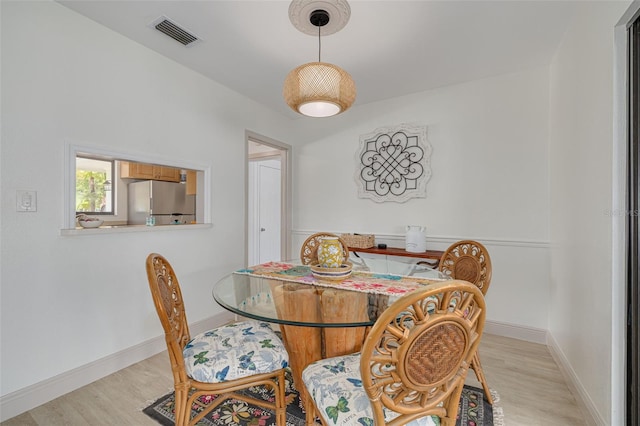 225 Cevera Dr, Dunedin, FL 34698 - dining room featuring light wood-type flooring, visible vents, and baseboards