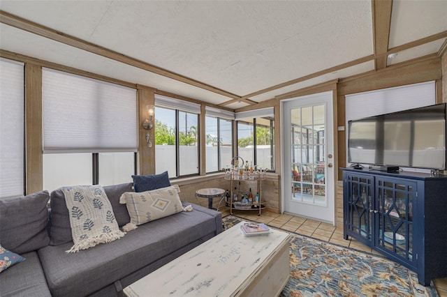 225 Cevera Dr, Dunedin, FL 34698 - living area with lofted ceiling, a textured ceiling, and tile patterned floors