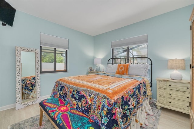 225 Cevera Dr, Dunedin, FL 34698 - bedroom featuring wood finished floors and baseboards