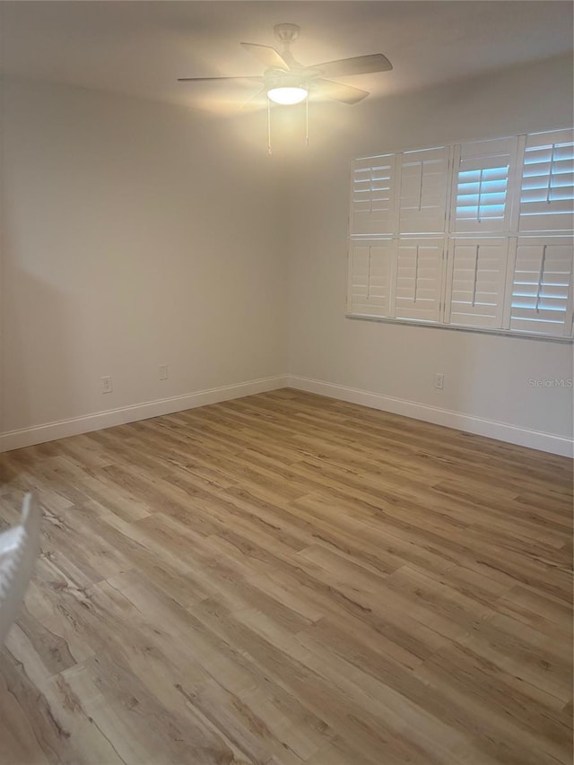 24862 US Highway 19 N Unit 2303, Clearwater, FL 33763 - unfurnished room featuring light wood-type flooring, baseboards, and ceiling fan