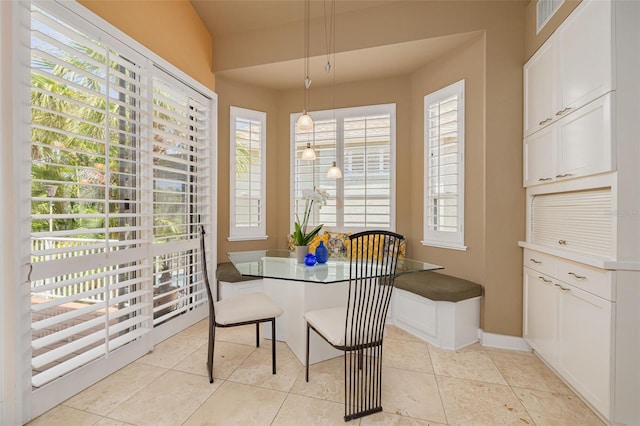 2613 59th St S, Gulfport, FL 33707 - dining space with plenty of natural light, breakfast area, and light tile patterned floors