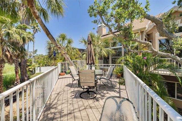 2613 59th St S, Gulfport, FL 33707 - wooden terrace with outdoor dining area