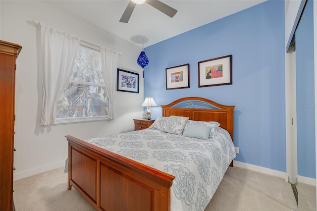2613 59th St S, Gulfport, FL 33707 - bedroom with light carpet and a ceiling fan