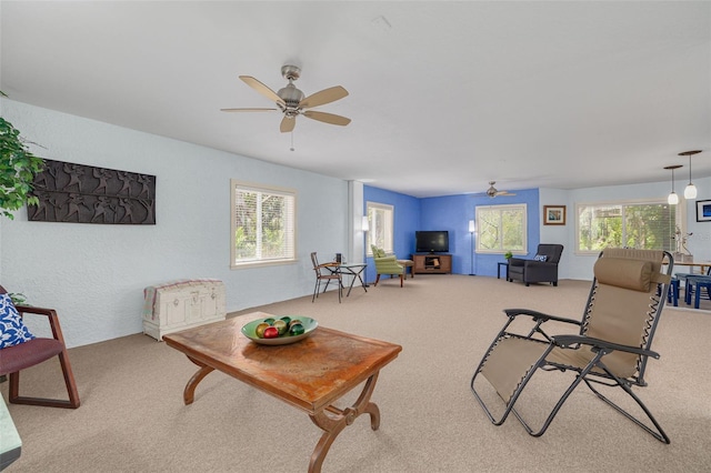 2613 59th St S, Gulfport, FL 33707 - living room featuring ceiling fan, plenty of natural light, and carpet flooring