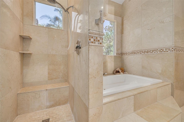 2613 59th St S, Gulfport, FL 33707 - full bath featuring a bath, tile walls, and a tile shower