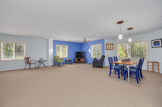 2613 59th St S, Gulfport, FL 33707 - dining room featuring carpet and a ceiling fan