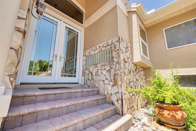 2613 59th St S, Gulfport, FL 33707 - entrance to property with french doors, stucco siding, and stone siding