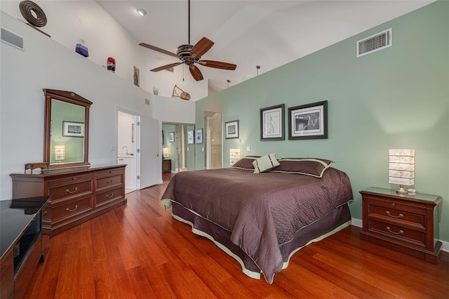 2613 59th St S, Gulfport, FL 33707 - bedroom featuring wood finished floors, connected bathroom, a closet, high vaulted ceiling, and a ceiling fan