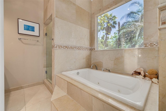 2613 59th St S, Gulfport, FL 33707 - full bath with a jetted tub, a shower stall, and tile patterned floors