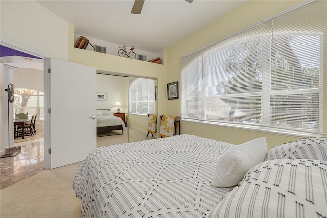 2613 59th St S, Gulfport, FL 33707 - bedroom featuring light colored carpet, a closet, and a ceiling fan