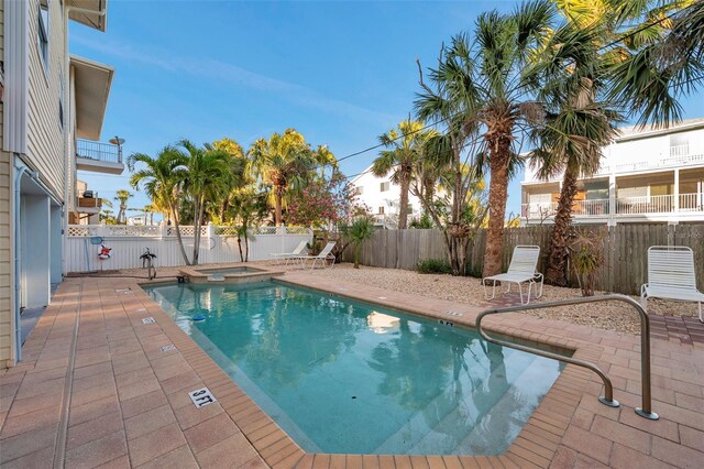 1809 Gulf Blvd, Indian Rocks Beach, FL 33785 - view of swimming pool featuring a fenced backyard, a pool with connected hot tub, and a patio