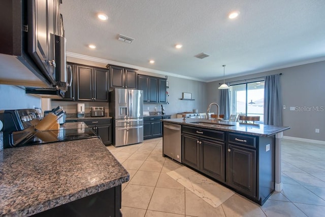 kitchen featuring ornamental molding, appliances with stainless steel finishes, a sink, and visible vents