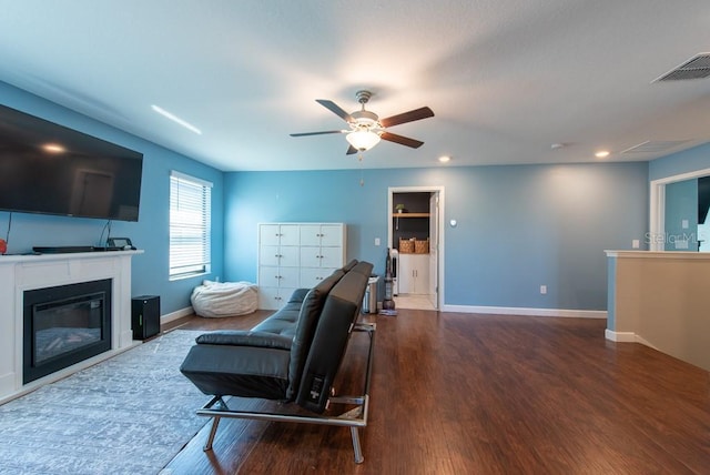 sitting room featuring wood finished floors, ceiling fan, baseboards, visible vents, and recessed lighting