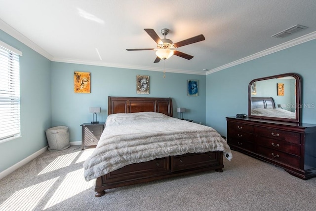 bedroom with ornamental molding, carpet flooring, multiple windows, and visible vents