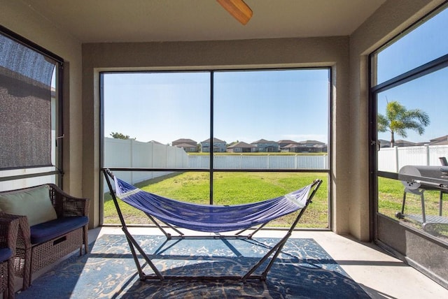 sunroom / solarium with a residential view