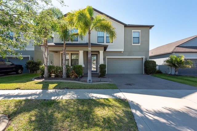 traditional-style home with stucco siding, an attached garage, driveway, a porch, and a front yard