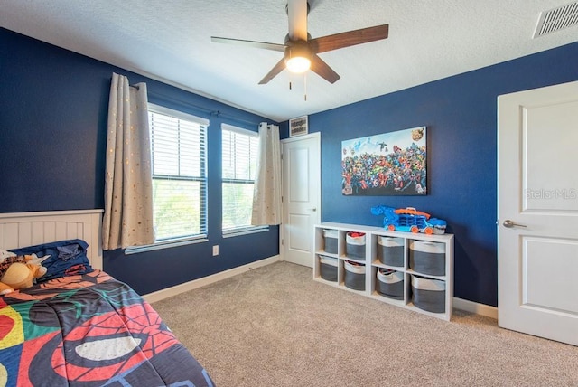 13639 Ashlar Slate Pl, Riverview, FL 33579 - bedroom with carpet, a textured ceiling, a ceiling fan, and baseboards
