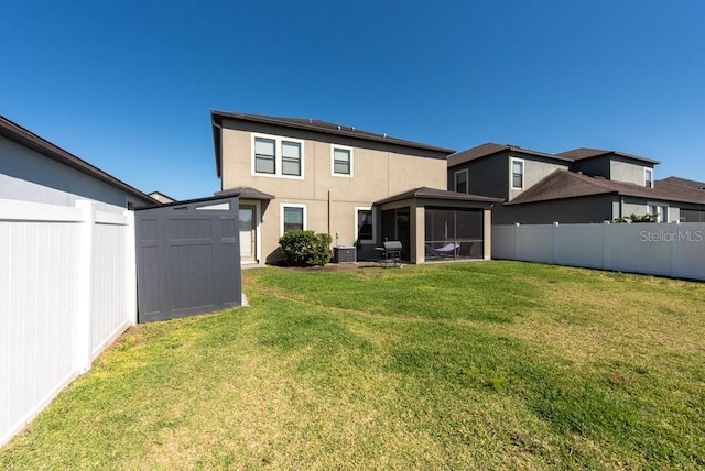 13639 Ashlar Slate Pl, Riverview, FL 33579 - back of house featuring a sunroom, central AC unit, and stucco siding