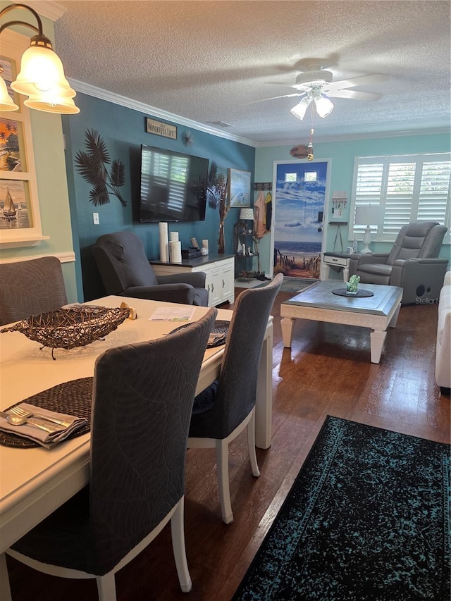 6190 80th St N Unit 204, Saint Petersburg, FL 33709 - dining room with wood finished floors, ornamental molding, ceiling fan, and a textured ceiling