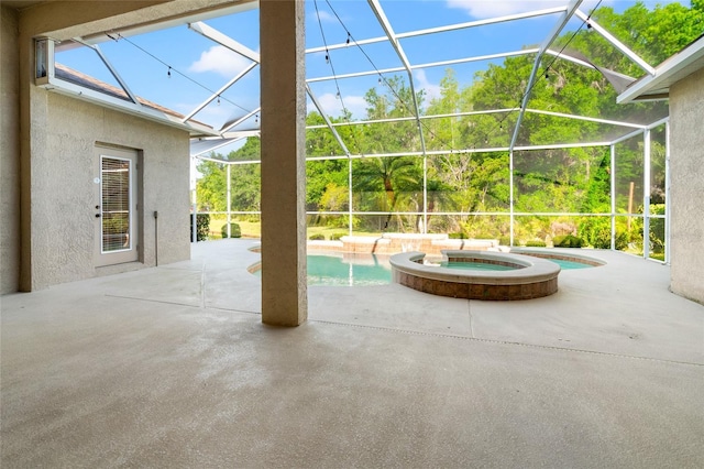 view of patio / terrace with glass enclosure and a pool with connected hot tub