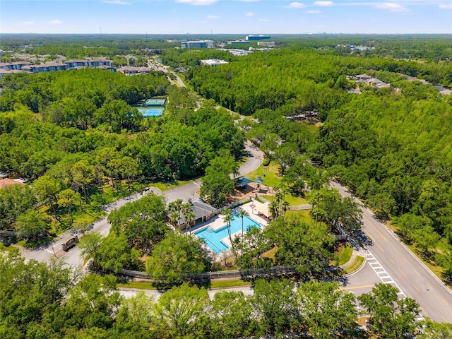 aerial view featuring a wooded view