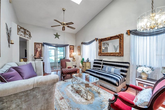 living room featuring high vaulted ceiling, wood finished floors, and ceiling fan with notable chandelier