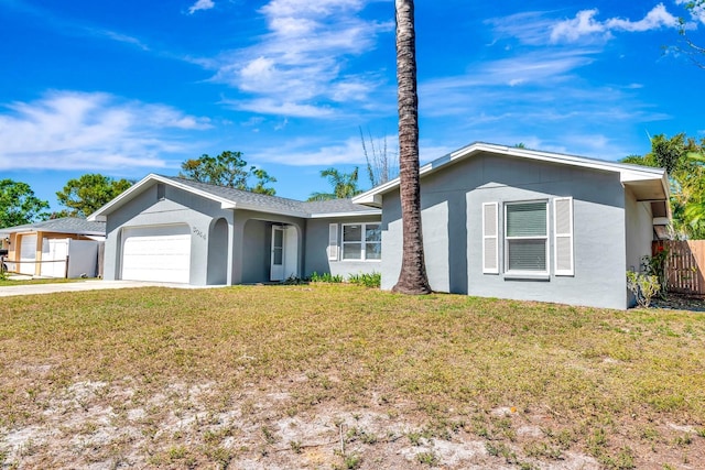 3044 Golden Rain Dr, Sarasota, FL 34232 - single story home featuring an attached garage, fence, a front lawn, and stucco siding