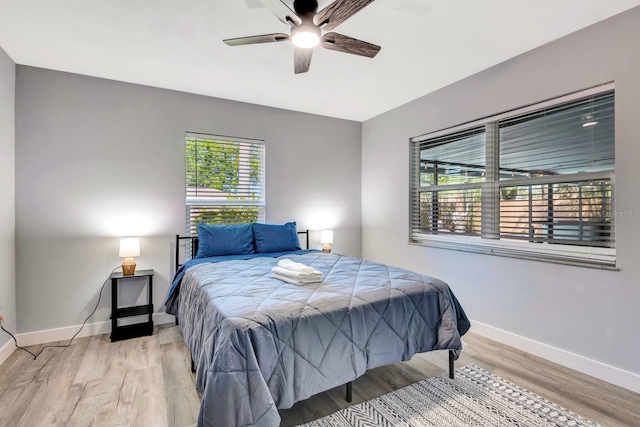 3044 Golden Rain Dr, Sarasota, FL 34232 - bedroom featuring baseboards, ceiling fan, and wood finished floors