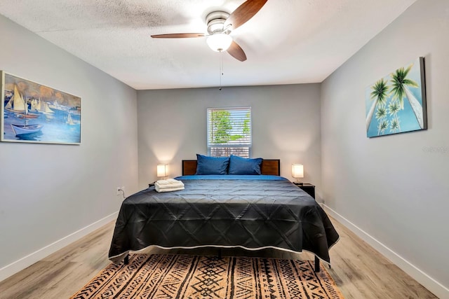 3044 Golden Rain Dr, Sarasota, FL 34232 - bedroom featuring light wood-style flooring, baseboards, and a ceiling fan