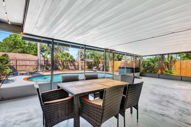 3044 Golden Rain Dr, Sarasota, FL 34232 - view of patio featuring outdoor dining space, a fenced backyard, and a fenced in pool