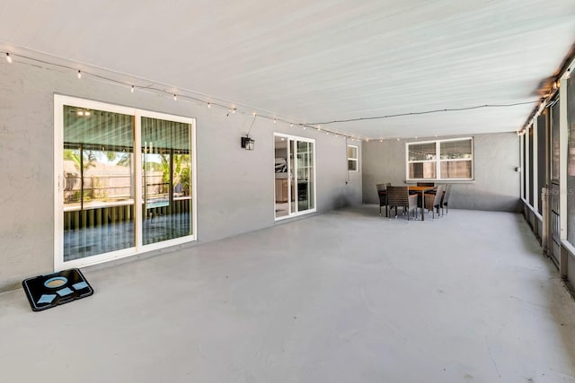 3044 Golden Rain Dr, Sarasota, FL 34232 - unfurnished sunroom featuring outdoor dining space