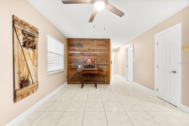 hall featuring baseboards
