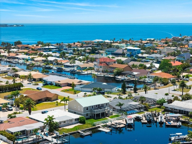 bird's eye view with a water view and a residential view