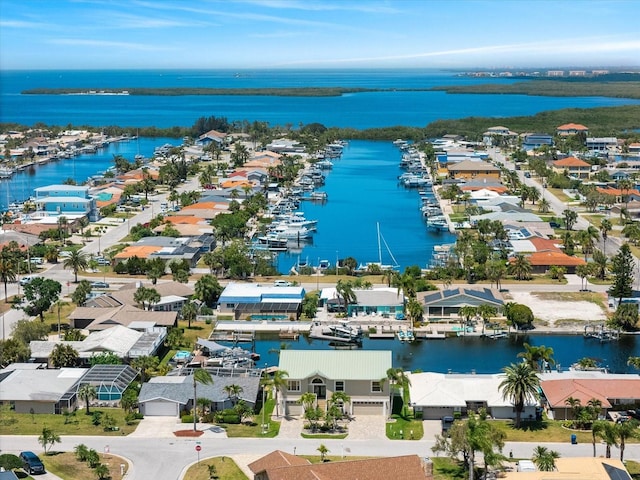 birds eye view of property with a water view and a residential view