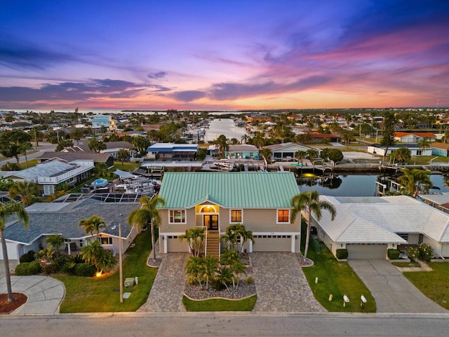 3505 Seaway Dr, New Port Richey, FL 34652 - aerial view at dusk of a water view and a residential view